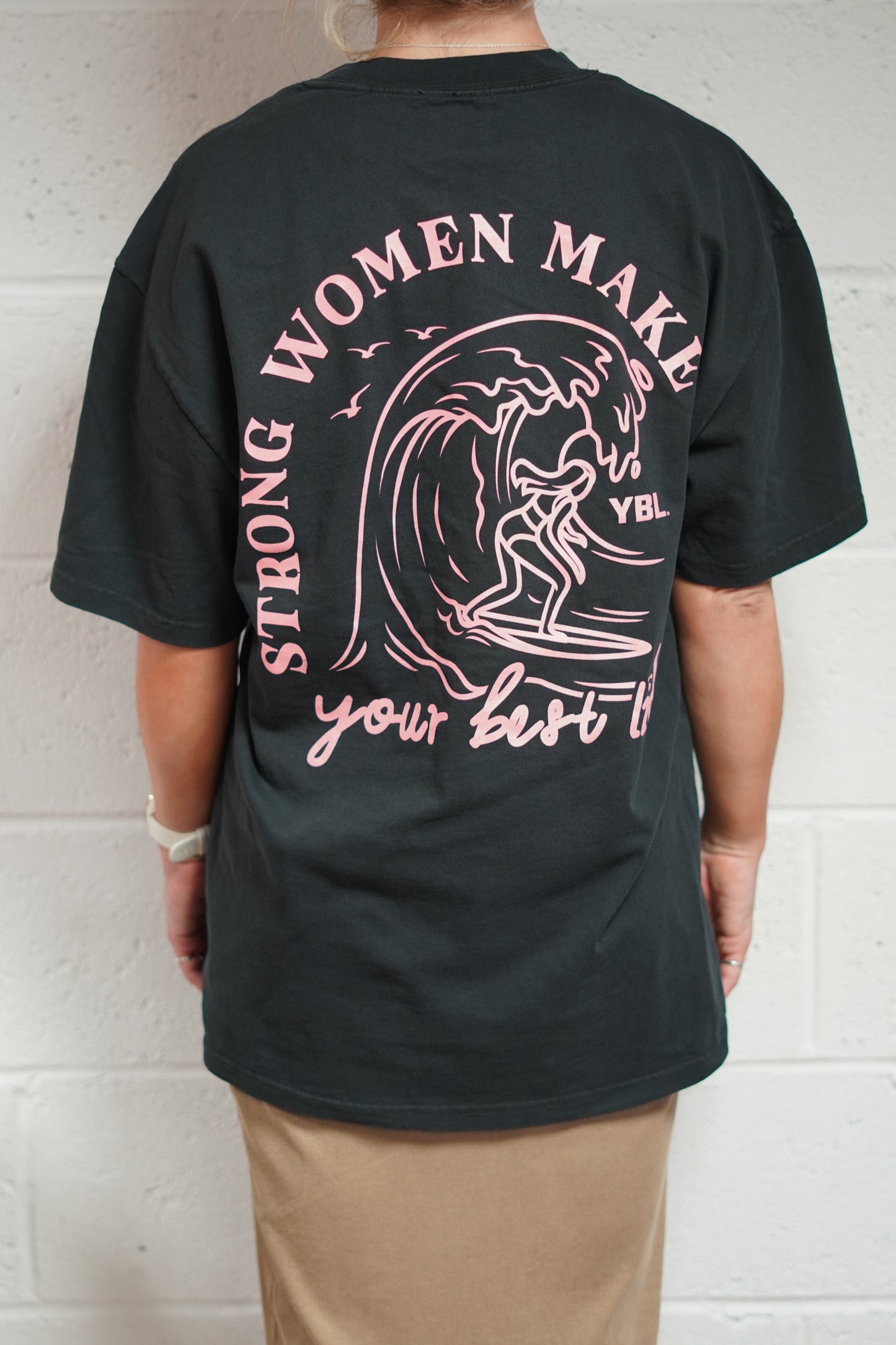Strong Women Make Waves Heavy Faded Tee in Faded Black with Pink Print